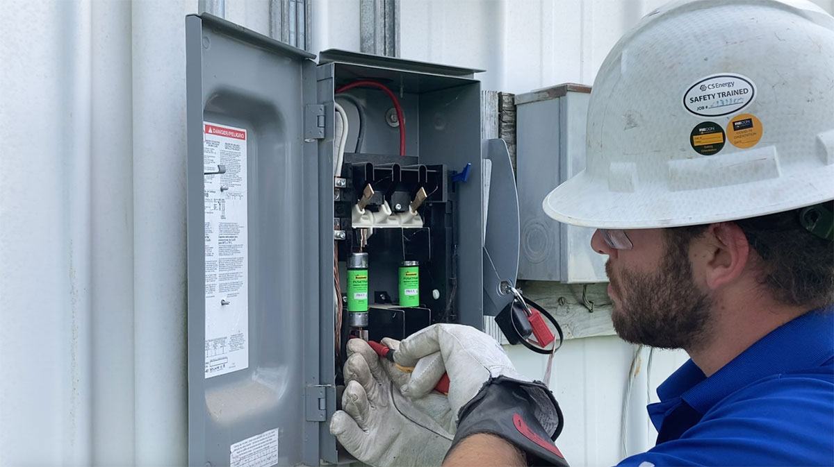 Paradise Energy Service Technician Doing Maintenance on Solar Panel System